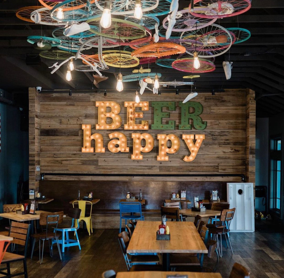 custom signs for mulitple locations of The Crooked Hammock restaurants BEER HAPPY ER flashes on and off so it says BE HAPPY and BEER HAPPY