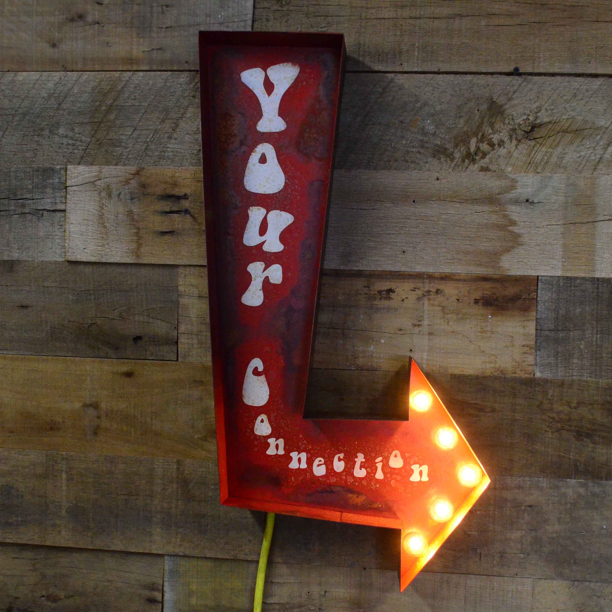 Stylish Arrows: Enhancing Boutique Hotel Decor with Painted Text Signs